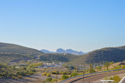 Scenic view of mountains against clear blue sky