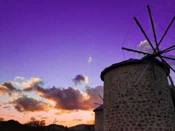 Low angle view of building against sky during sunset