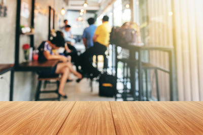 Group of people sitting on table