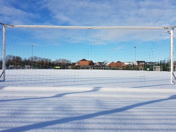 Scenic view of snow covered landscape against blue sky