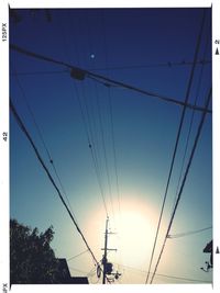 Low angle view of electricity pylon