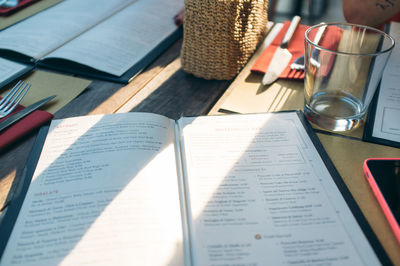 Close-up of pen on book