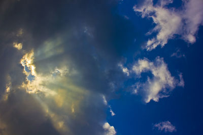 Low angle view of blue sky and clouds