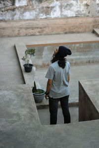 Rear view of young man standing outdoors