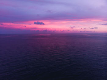 Pink sunset horizon background in open sea from puerto rico. sky and clouds only