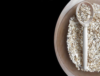 Directly above shot of breakfast in bowl against black background