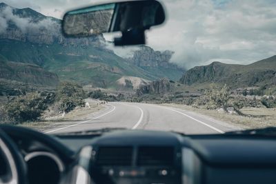 Road seen through car windshield