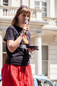 Full length of a woman drinking drink