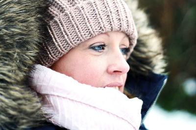 Close-up portrait of baby in snow