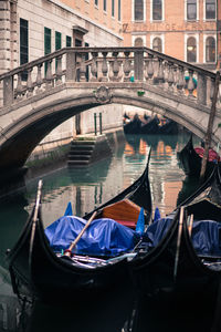 Boats in river with buildings in background