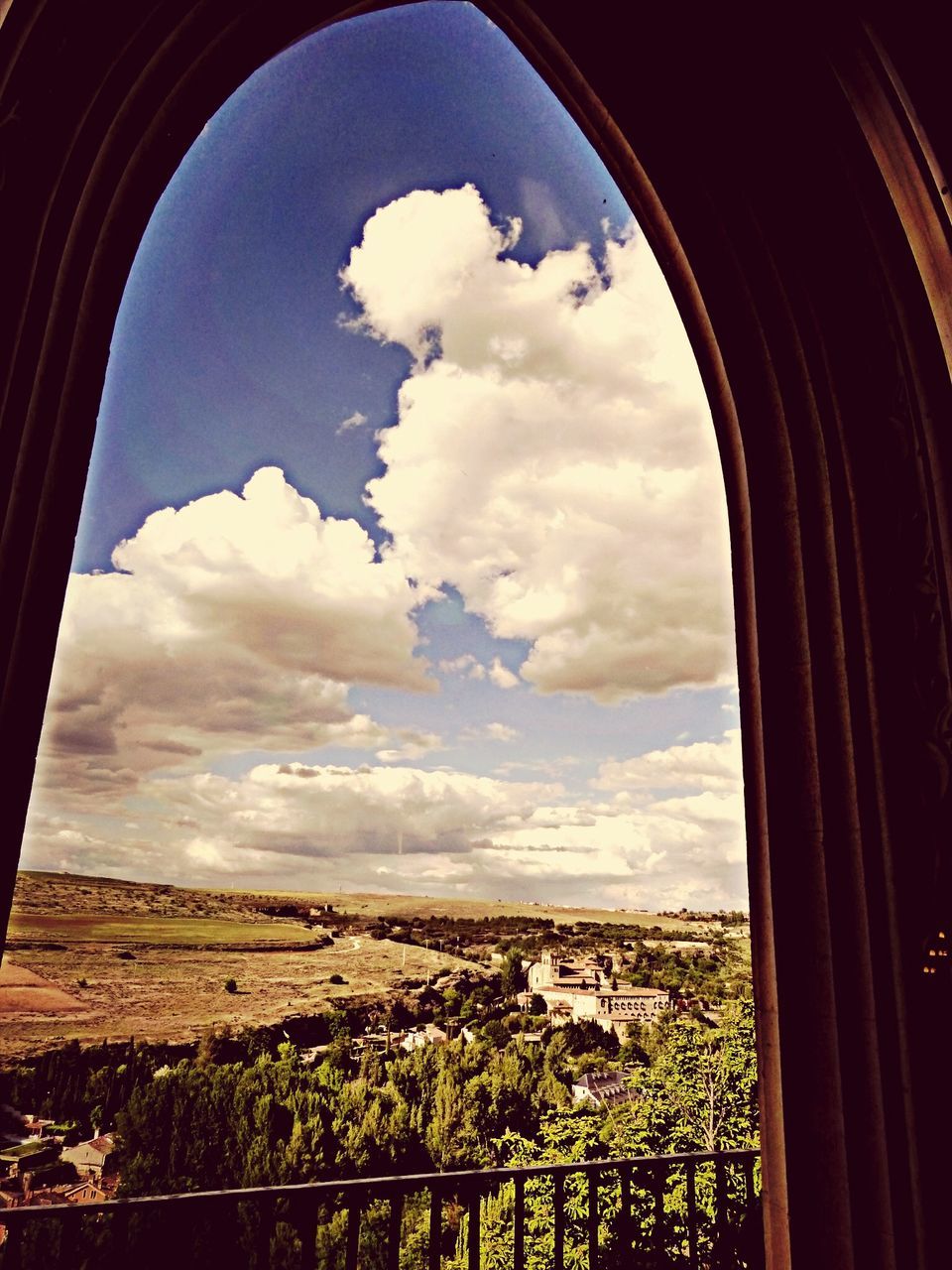 sky, indoors, cloud - sky, window, built structure, architecture, cloud, cloudy, landscape, arch, scenics, nature, day, house, transparent, glass - material, building exterior, tranquility, tranquil scene, beauty in nature