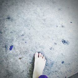 Low section of woman standing on ground