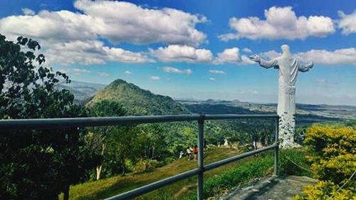 Scenic view of landscape against cloudy sky