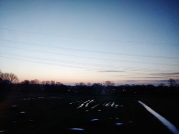 Scenic view of silhouette landscape against clear sky during sunset