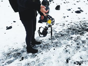 Full length of man standing on snow covered land