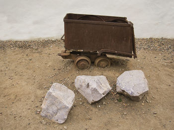 High angle view of old garbage on rock