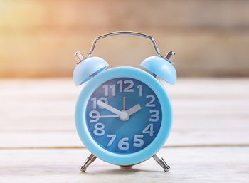 Close-up of clock on table