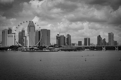 City skyline against cloudy sky