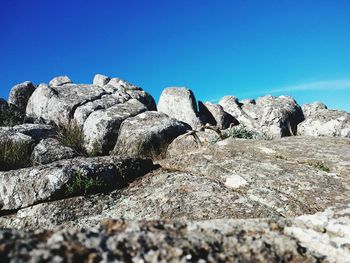 Scenic view of mountains against clear blue sky