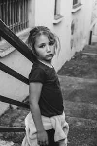 Portrait of girl standing on steps