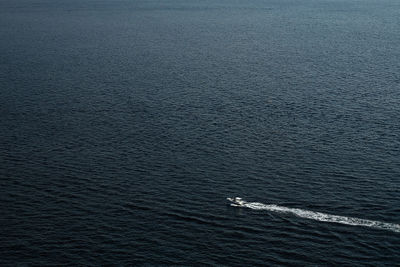 Boat in the sea, mountain on the background of the sea