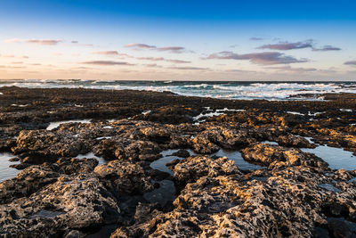 Scenic view of sea against sky during sunset