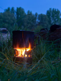 Cooking in a tiny wood stove while camping at danube river