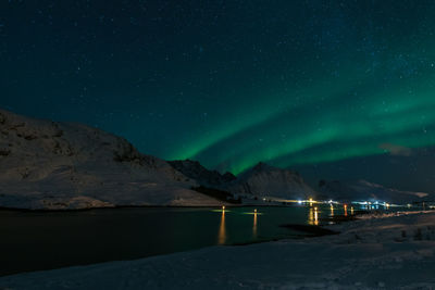 Scenic view of landscape against clear sky at night