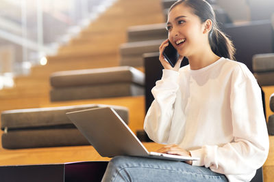 Young woman using mobile phone