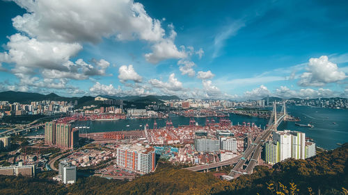 High angle view of buildings and trees against sky