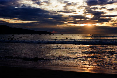 Scenic view of sea against cloudy sky