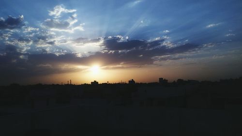 Silhouette landscape against sky during sunset