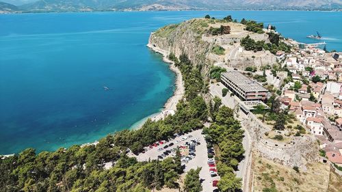 High angle view of sea and buildings in city