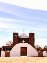 Church amidst buildings against sky