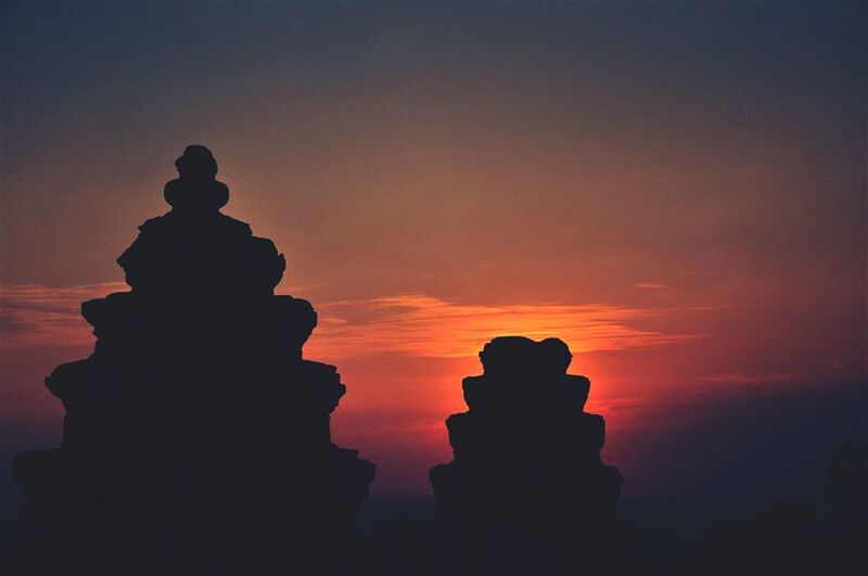 sunset, silhouette, sky, tranquility, sculpture, scenics, statue, orange color, tranquil scene, art and craft, cloud - sky, dusk, human representation, beauty in nature, nature, art, spirituality, outdoors, no people, rock - object