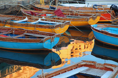 High angle view of fishing boats moored at harbor