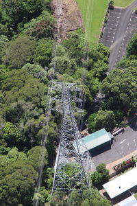 Low angle view of overhead cable car against sky