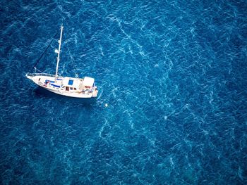 High angle view of boat in calm blue sea