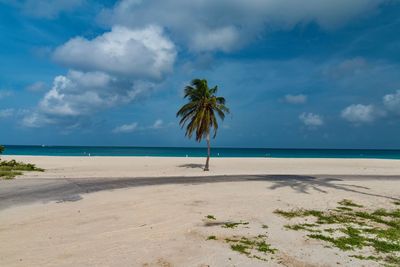 View of beach against cloudy sky