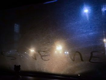 Silhouette of light painting on glass