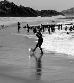 People playing on beach