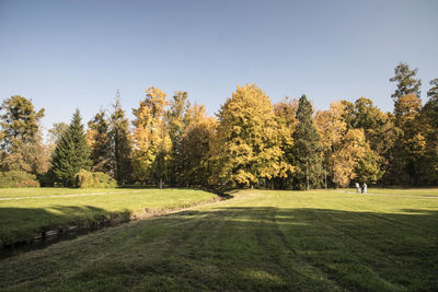 Scenic view of golf course against sky