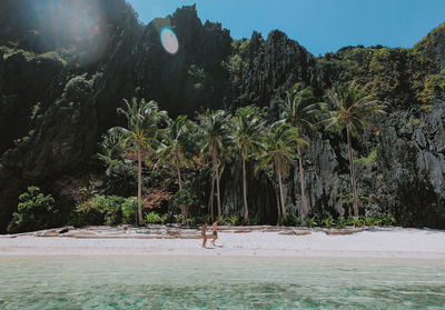 Couple at beach on sunny day