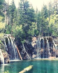Scenic view of river flowing through rocks