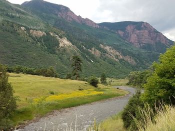 Scenic view of landscape and mountains against sky