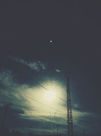 Low angle view of power lines against sky