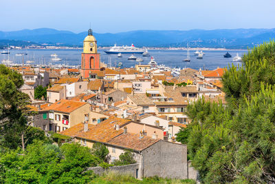 High angle view of townscape by sea