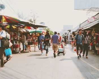 People on road in city