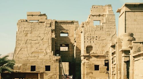 Old ruins of medinet habu against clear sky