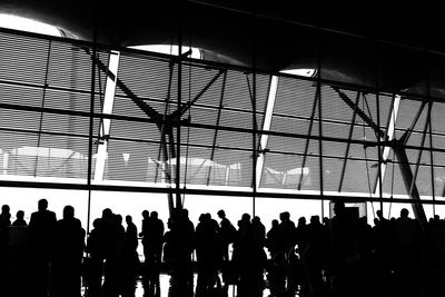 Silhouette people standing in airport